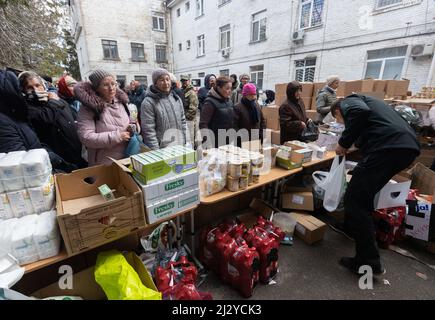 President of Ukraine Volodymyr Zelenskyy visited the city of Bucha in the Kyiv region, where mass killings of civilians took place during the occupation by Russian troops. Zelenskyy visited the humanitarian aid center and talked to local residents, on April 04, 2022. Bucha Mayor Anatoliy Fedoruk told the President about the humanitarian situation in the city, the progress of the search for the bodies of the dead, the assessment of the damage caused by the occupiers to private and communal property, and the pace of reconstruction of the city. Volodymyr Zelenskyy awarded Anatoliy Fedoruk with th Stock Photo