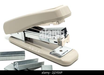 Stapler with staples on a white background. Gray Stapler Isolate Stock Photo