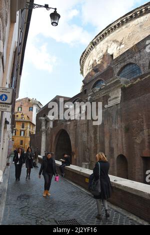 Pedestrians walk along Via della Minerva beside the Pantheon, Rome, Italy, November 23, 2017. Stock Photo