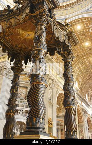 Peter's Baldachin  is a large Baroque sculpted bronze canopy, technically called a ciborium or baldachin, over the high altar of St. Peter's Basilica Stock Photo