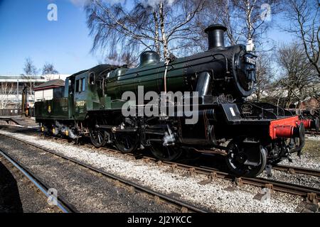 British  Railways Steam Locomotive Standard Class 2MT 2-6-0 Number 78022 at Keighley Railway Station on the steam heritage railway line Stock Photo