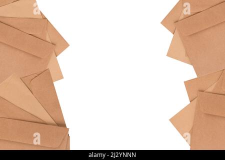 Frame made of brown kraft paper envelopes of different types isolated on white background for your design project. Letter, top view. Mockup, copy spac Stock Photo