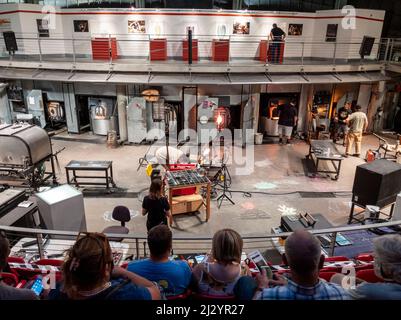 Tacoma, WA USA - circa August 2021: View of glass blowers doing a live demonstration at the Museum of Glass. Stock Photo