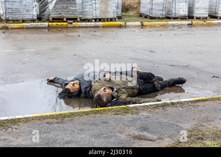 Bodies of civilians lie on a street after a Russian airstrike in ...