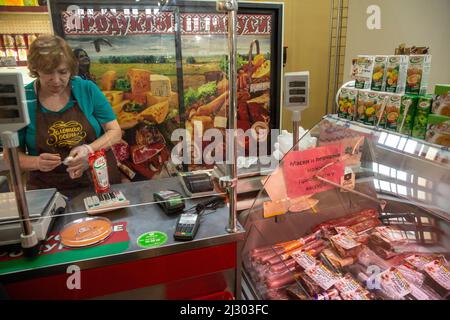 Moscow, Russia. 3rd of April, 2022. A saleswoman sales food in the Belarusian grocery shop on the territory of Exhibition and Trade Center of the Republic of Belarus (Pavilion No.18) on VDNKh in Moscow, Russia Stock Photo