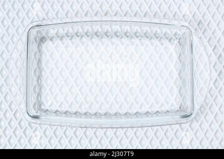 A baking dish cleaned from a thick layer of carbon. Glassware for baking after washing with a steam cleaner. Stock Photo