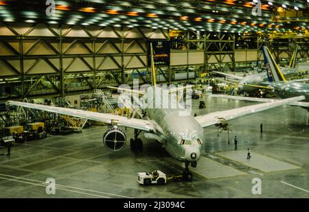 Production line of the Boeing 777 at the site in Everett near Seattle. Planes waiting to have the engines assembled. While being erected the production hall was dubbed the biggest building on earth. Stock Photo