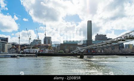 Wide angle view of the Tate Modern Gallery, Globe Theatre and the Millennium Bridge on a sunny day over the River Thames. London - 12th March 2022 Stock Photo