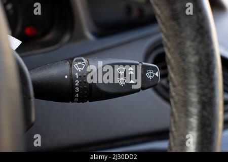 A soft focus of a windscreen wiper adjustment control lever in a modern car Stock Photo