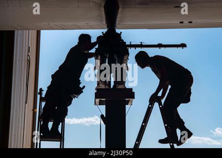 March 4, 2022 - Cannon Air Force Base, New Mexico, USA - U.S. Air Force Senior Airman Dakota Ball, and Staff Sgt. Brett Doyle, both 16th Aircraft Maintenance Unit, 27th Special Operations Aircraft Maintenance Squadron weapons load crew members, load missiles onto an AC-130W Stinger II gunship aircraft during the 27th Special Operations Maintenance Group 2021 Annual Load Crew of the Year competition at Cannon Air Force Base, New Mexico, March 4, 2022. During weapons load competitions, each competing load crew is evaluated on safety, technical proficiency, and timeliness. (Credit Image: © U.S. A Stock Photo