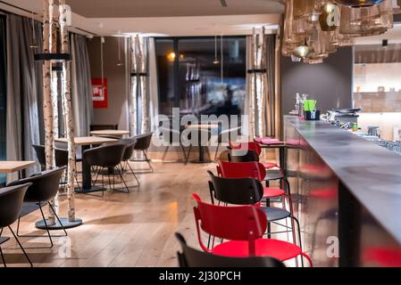Row of empty chairs at bar counter in luxurious hotel Stock Photo