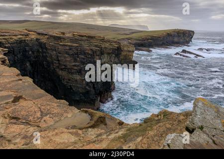 Storm, surf breaker, sandstone cliffs of Yesnaby, clusters of rays, Orkney, Scotland UK Stock Photo
