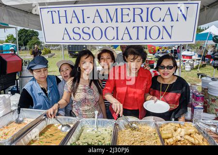 Miami Florida,Homestead,Fruit and Spice Park,Asian Culture Festival,festivals celebration fair,Thai-American Association women,preparing food vendor Stock Photo