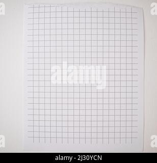 Checkered paper with torn top edge, blank blank sheet, texture and background, copy of space, template. Stock Photo