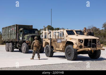 U.S. Marines with Combat Logistics Battalion (CLB) 22, Combat Logistics Regiment 27, 2nd Marine Logistics Group, prepare to depart Mile Hammock Bay on Camp Lejeune, North Carolina, April 1, 2022. CLB-22 conducted a battalion field exercise from March 28 through April 1 in order to exercise the battalion’s full range of combat service support in an expeditionary environment. (U.S. Marine Corps photo taken by Lance Cpl. Sixto Castro) Stock Photo