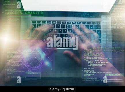Innovation at his fingertips. Digitally enhanced shot of an unidentifiable computer programmer working on his laptop in the dark. Stock Photo