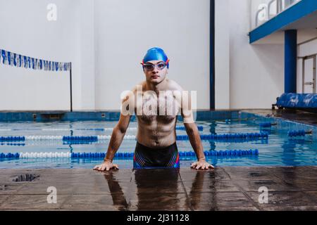 Hispanic boy swim pool water hi-res stock photography and images