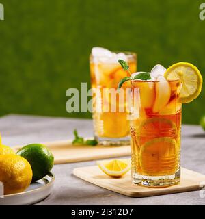Iced tea. Traditional iced tea with lemon and ice in tall glasses Stock Photo