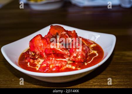 Not exactly a classic Indian Chicken Curry - the world famous classic chicken tikka masala (well, the sauce anyway) was invented in Glasgow Stock Photo