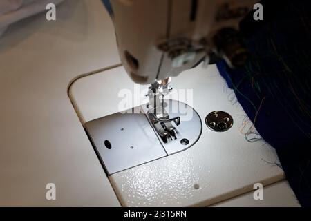 Close up of modern industrial sewing machine. Selective focus. Stock Photo