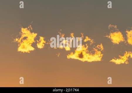 Colorful clouds glowing in the sunlight at sunrise, Bodrum, Turkey Stock Photo
