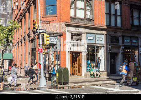 NEW YORK, USA - OCT 5, 2017: people cross the street Broadway at a pedestrian crossing. The Broadway ist the most common street in New York and  a lan Stock Photo