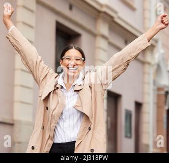 Youll never find her where your shoes are. Portrait of a young businesswoman happily walking outside while out in the city. Stock Photo