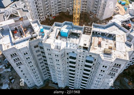 newly built multistory apartment house ready for roof installing. aerial view with drone. Stock Photo