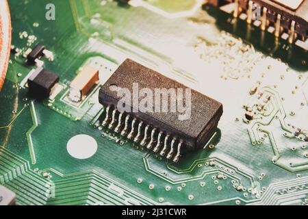 Integrated circuit (IC) on the electronic circuit board of the computer laptop,closeup macro Stock Photo