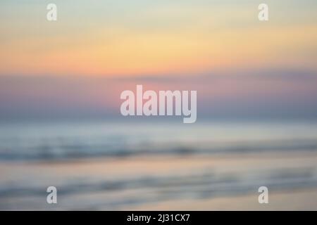 The background was blended with a sunset and an ocean, abstract blurred background Stock Photo