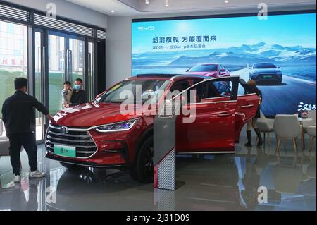 Store Sale A customer selects a new energy vehicle at a Xiaomi store in Longfor ...