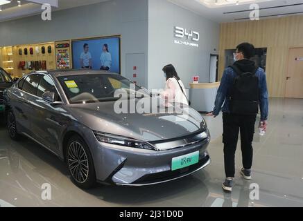 A customer selects a new energy vehicle at a Xiaomi store in Longfor ...