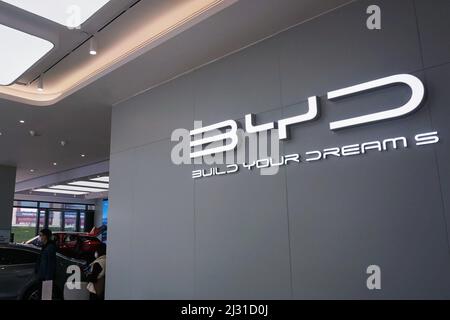 A customer selects a new energy vehicle at a Xiaomi store in Longfor ...