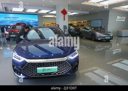 A customer selects a new energy vehicle at a Xiaomi store in Longfor ...