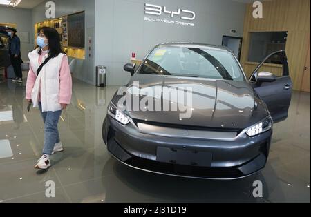 A customer selects a new energy vehicle at a Xiaomi store in Longfor ...