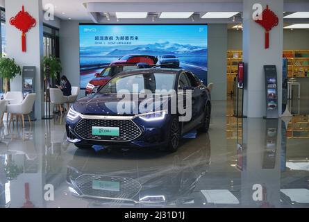 A customer selects a new energy vehicle at a Xiaomi store in Longfor ...