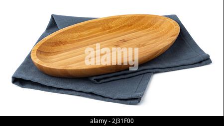 Wooden plate and tablecloth on white background Stock Photo