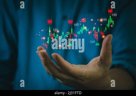 Finance and business investment concept. Stock and crypto investment funds.Businessman analyzing or trading Forex graphs of financial data candlestick Stock Photo