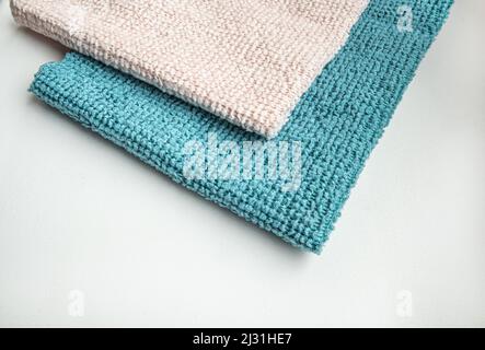 Close-up of two microfiber cleaning cloths, top view. Lying flat, a copy of the space. Stock Photo