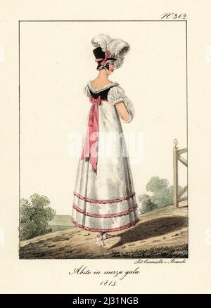 Fashionable woman in semi-formal outfit, 1815. In bonnet with plumes, high-waisted gown with black bodice, pink ribbons. Costume demie habille. Handcoloured lithograph by Lorenzo Bianchi and Domenico Cuciniello after Hippolyte Lecomte from Costumi civili e militari della monarchia francese dal 1200 al 1820, Naples, 1825. Italian edition of Lecomte’s Civilian and military costumes of the French monarchy from 1200 to 1820. Stock Photo