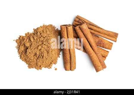 Dry cinnamon sticks and cinnamon powder isolated on a white background. Cinnamon spice. Stock Photo