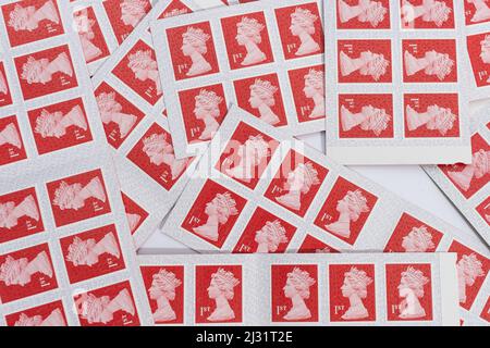 An assorted  pile of 1st class stamps Stock Photo
