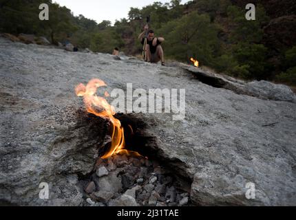 Chimaera flames, Mount Olympos, methane emissions which burning since the 4th century, Olympos national park, Cirali, Lykia, Turkey, Mediteranean sea Stock Photo