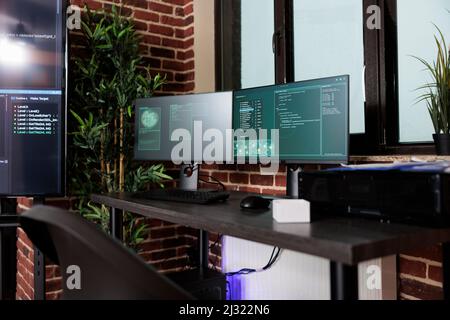 Image of two computer screens displaying software data information and integrated algorithms. Multiple display cyber security setup computing artificial intelligence communication program. Stock Photo