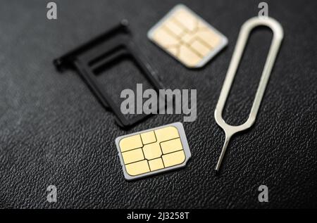 SIM card for smart phone. Changing the SIM card. Stock Photo