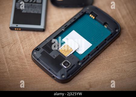 SIM card for smart phone. Changing the SIM card. Stock Photo