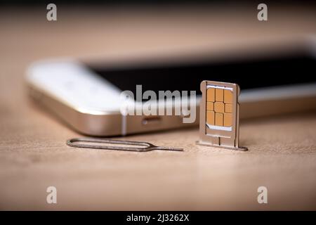 SIM card for smart phone. Changing the SIM card. Stock Photo