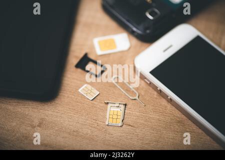 SIM card for smart phone. Changing the SIM card. Stock Photo