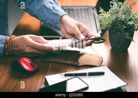 Closeup external hard drive on wooden desktop. Working with external hard drive. Stock Photo