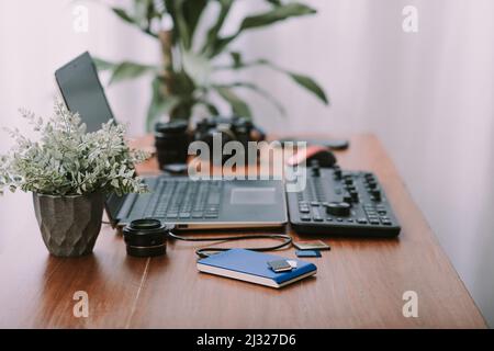Closeup external hard drive on wooden desktop. Working with external hard drive. Stock Photo